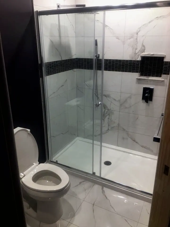 Basement bathroom with a glass shower
